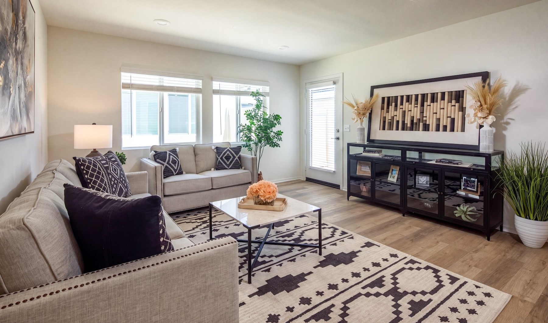 a living room with couches and tables