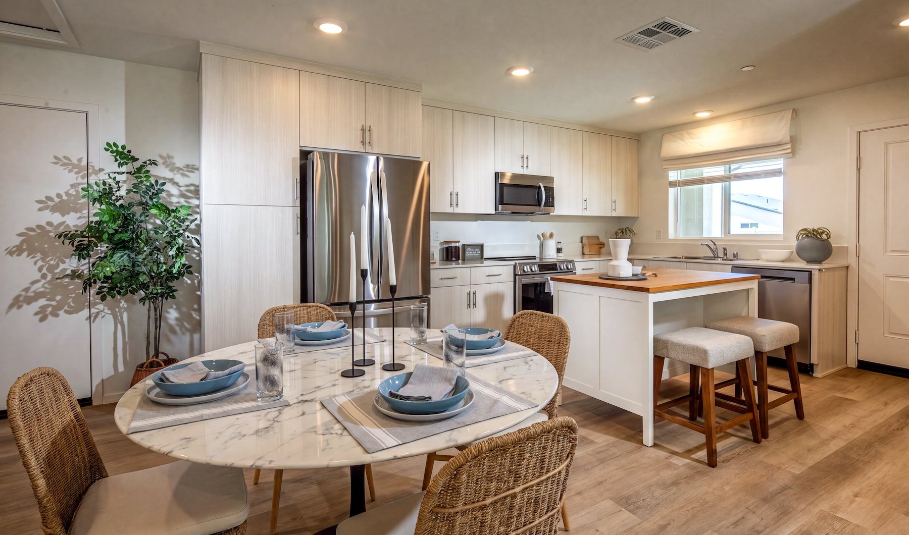 a kitchen with a dining table and chairs