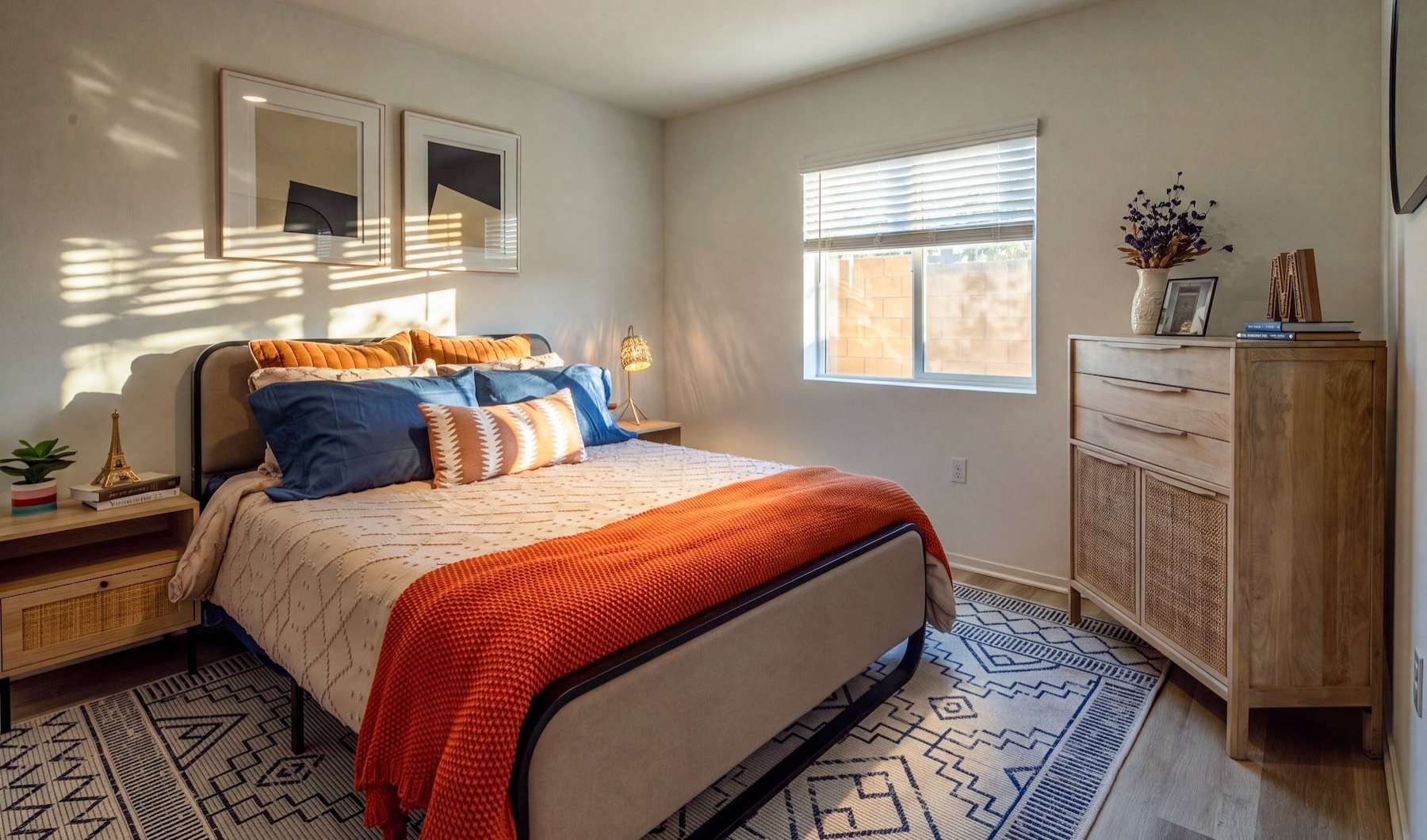a bedroom with a bed and a dresser