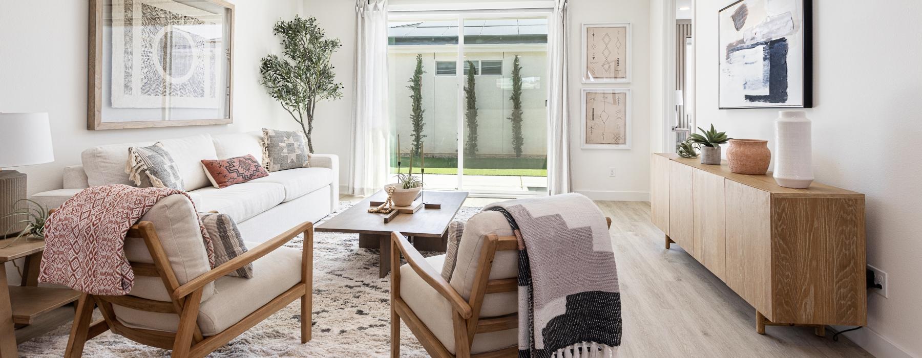 a living room with a table, chairs and a couch
